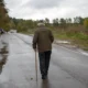 depositphotos 544605950 stock photo old man walks road pensioner